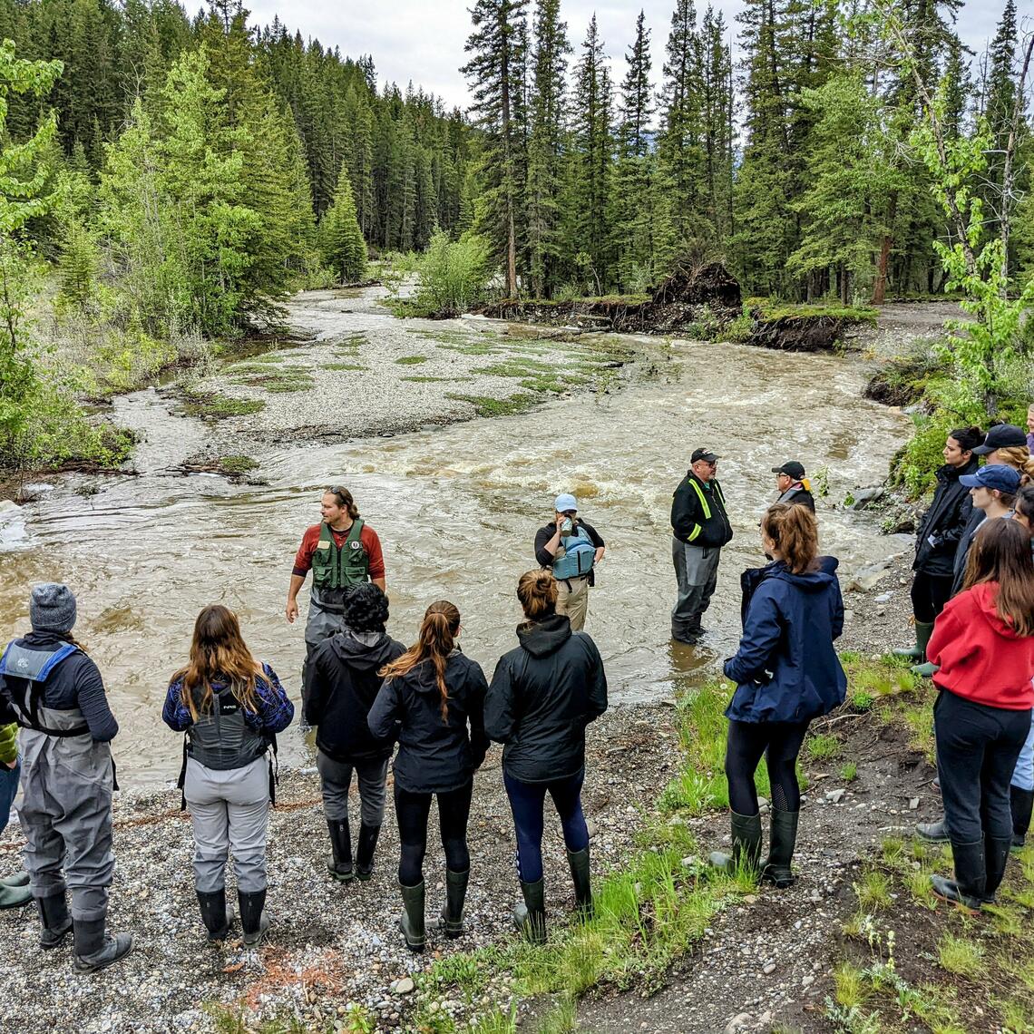 Group of people by a river