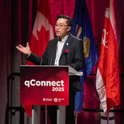 Emcee speaks to crowd from podium