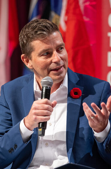 Moderator speaks to panel